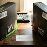 NVIDIA GeForce RTX 5060 Ti retail box at $429 and AMD Radeon RX 9060 XT retail box at $349 standing side by side on desk with handwritten "Which one?" card between them