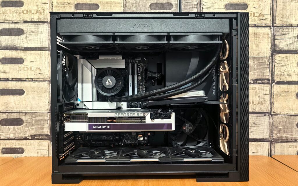 Inside a built gaming PC: a 360mm AIO radiator along the top of the case, the pump block on the CPU, a GeForce RTX graphics card below it and a row of fans across the bottom