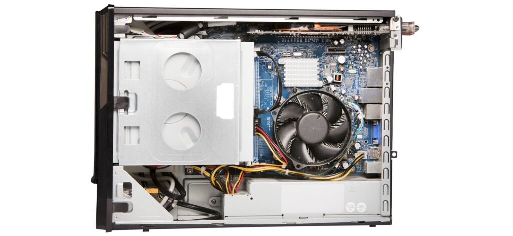 An opened branded desktop PC showing the motherboard and power supply