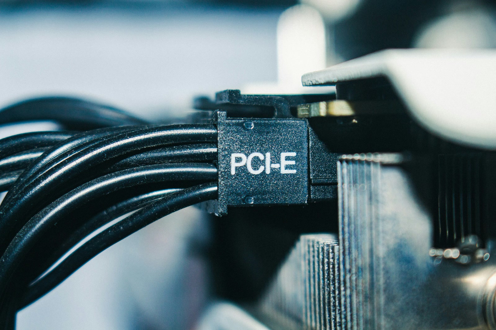 A PCIe power connector plugged into a graphics card